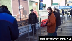 Workers put up a barrier near Triumph Square in Moscow prior to today's 'Strategy 31' protest.