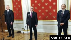 Russian President Vladimir Putin (center), Azerbaijani President Ilham Aliyev (right), and Armenian Prime Minister Nikol Pashinian attend a joint press conference following a trilateral meeting at the Kremlin in Moscow on January 11. 