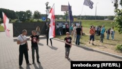 Protesters rally against building of a restaurant near Kurapaty memorial to the victims of Stalinist repressions on June 25.