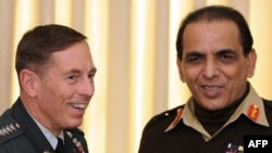 Pakistani Army chief Ashfaq Kayani (right) and U.S. General David Petraeus during a meeting in Islamabad on January 20.