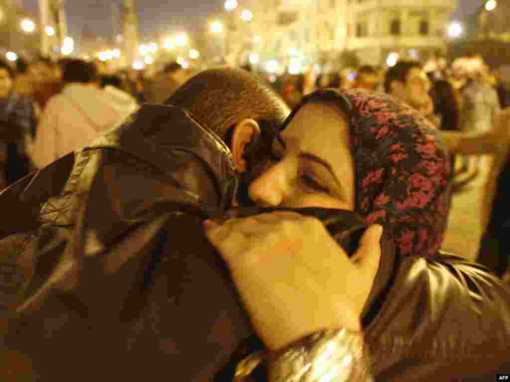 Antigovernment protesters celebrate outside the presidential palace in Cairo after Mubarak resigns on February 11.