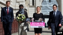 Former British servicemen arrive with an interpreter named Mohammed (2nd left) at the Foreign and Commonwealth Office in London on May 3 to deliver a petition calling for asylum for Afghan interpreters who served the British Army.