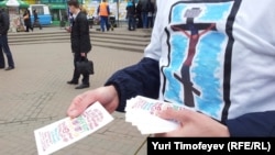 An activist hands out leaflets during an action in Moscow in support of Pussy Riot in 2012.