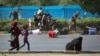 WATCH: State television said gunmen opened fire at the event, targeting a stand where Iranian officials were gathered to watch an annual military parade marking the start of the country's 1980-88 war with Iraq. 