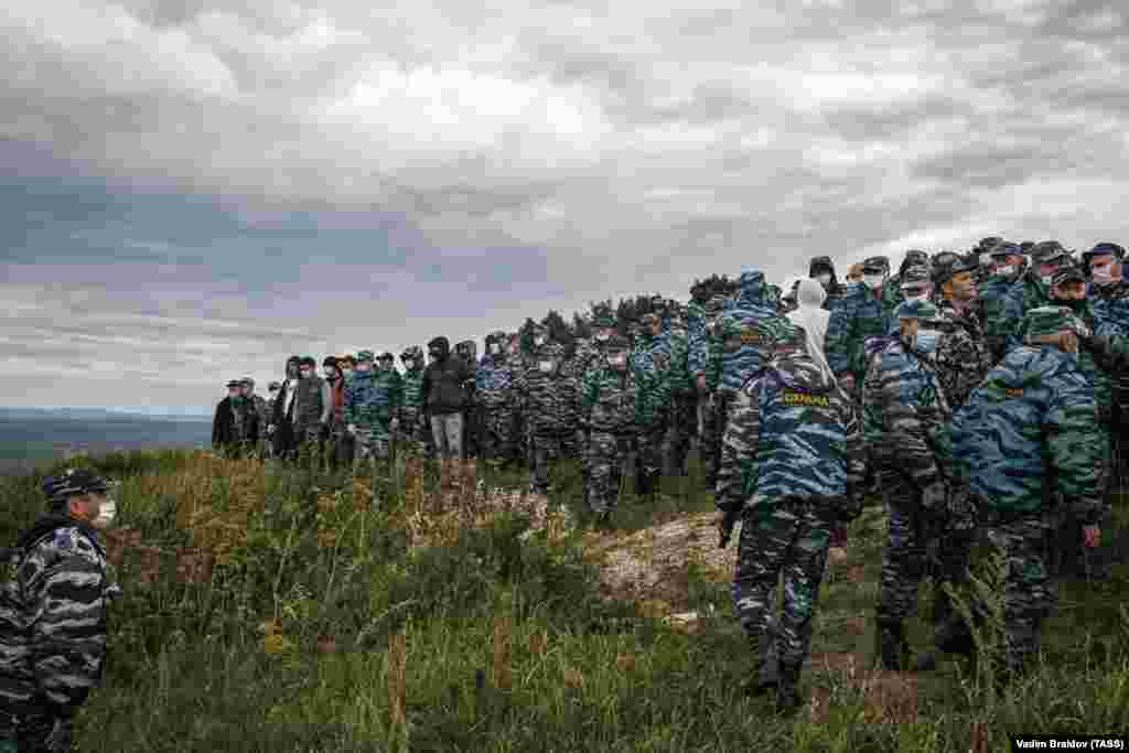 Private security guards gather on Kushtau Hill.