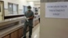 A doctor enters an isolation ward set up at the Jinnah Postgraduate Medical Center in Karachi, Pakistan.