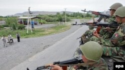 Kyrgyz soldiers patrol in Jalal-Abad on June 17.