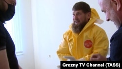 Wearing a yellow protective suit, Ramzan Kadyrov visits a hospital for patients with suspected COVID-19 in Grozny on April 20. The Chechen leader is now reported to have been infected with the disease. 