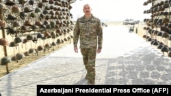 Azerbaijani President Ilham Aliyev tours Baku's Military Trophies Park, which showcases equipment seized from Armenian troops during the 2020 war over the disputed Nagorno-Karabakh region. 