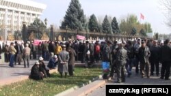 Protesters outside the national legislature in Bishkek on November 12 insist on the immediate release of the detained men.