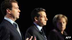 "I believe we have a good chance to restart the process and achieve results," said Russian President Dmitry Medvedev (left), with French President Nicolas Sarkozy and German Chancellor Angela Merkel in Deauville on October 19. "Russia will support this."