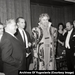 Tito chats with the manager of Yugoslavia's National Theater and an actor in stage makeup in 1968.