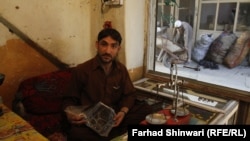 A Pakistani hashish seller shows off his "black gold" in the country's northern tribal region. 