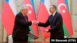 Czech President Milos Zeman (left) and Azerbaijani President Ilham Aliyev shake hands after signing a declaration on strategic partnership between the two countries in Baku on September 16.