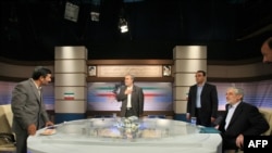 President Mahmud Ahmadinejad (left) and reformist rival Mir Hossein Musavi (right) at their televised debate on June 3.