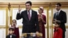 Turkmen President Gurbanguly Berdymukhammedov (center) casts his ballot as his son Serdar (right) stands with other family members at a polling station in Ashgabat in February 2017.