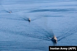 Warships in the Sea of Oman take part in joint Iranian-Chinese-Russian naval exercises in December 2019.