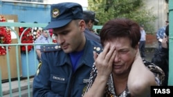 A woman mourns at the blast site in Vladikavkaz on September 9.