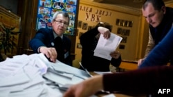 People count ballots for the leadership vote in the self-declared "Donetsk People's Republic" at a polling station in Donetsk on November 2.