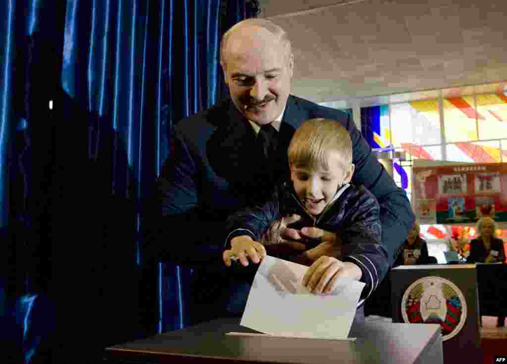 Lukashenka votes at a polling station in Minsk in September 2008, 4-year-old Kolya at his side.