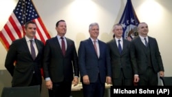 Serbia's Milun Trivunac (left to right), U.S. envoys Richard Grenell and Robert C. O'Brien, Eurowings managing director Michael Knitter, and Kosovo's Eset Berisha pose for a photo at a press conference in Berlin on January 20.