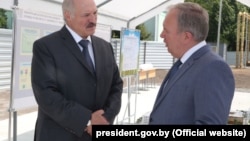 President Alyaksandr Lukashenka (left) speaks with former Deputy Prime Minister Vasil Zharko in June 2016. "I had warned him three times: Look around, sort things out," Lukashenka says. "And things collapsed there. How can I work with such a person?" 