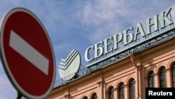 The new sanctions will limit the operational ability of major Russian banks, including Sberbank (pictured) and VTB Bank, according to "The Wall Street Journal."