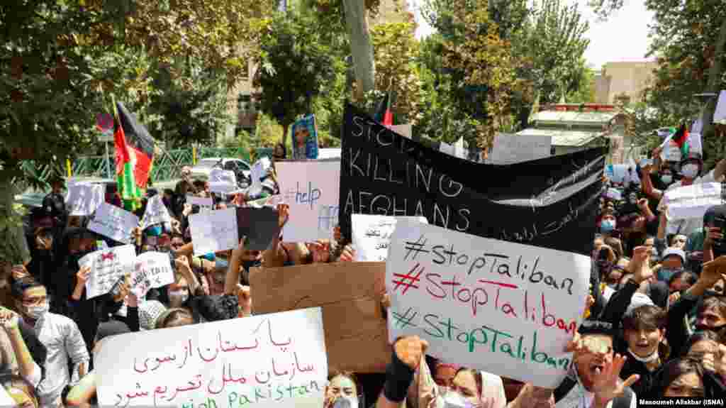 Afghans gather in front of the UN office in Tehran to protest Taliban rule in Afghanistan on August 15.