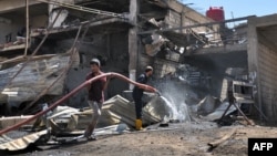 The aftermath of a suicide bomb attack targeting Kurdish security forces in Qamishli in Syria's northeastern Hasakeh Province in August