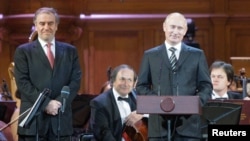 Valery Gergiyev (left), artistic director of the Mariinsky Theater, and Russian leader Vladimir Putin open the International Tchaikovsky Competition in Moscow in June 2011.