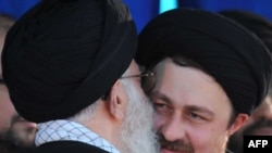 Supreme leader Ayatollah Ali Khamenei (left) kisses Hassan Khomeini, grandson of late founder of Islamic Republic, on the anniversary of his death.