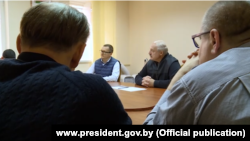 Alyaksandr Lukashenka (center right) meets with detained opposition leaders on October 10.