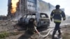 Ukrainian firefighters extinguish a blaze on September 1 after a Russian missile attack in Kharkiv.