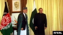 Afghan President Hamid Karzai (left) met with Pakistani Prime Minister Nawaz Sharif in Islamabad in August