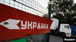 A truck from a Russian convoy carrying humanitarian aid for Ukraine enters a border crossing point for customs control, in Russia's Rostov region, on August 20.