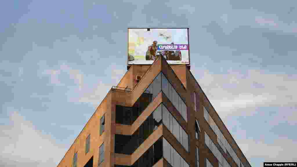 A photo of a now-deceased Armenian soldier is displayed on a building in central Yerevan on October 28.&nbsp;