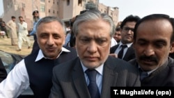 Pakistani Finance Minister Ishaq Dar arrives to appear before an accountability court in Islamabad on September 25.