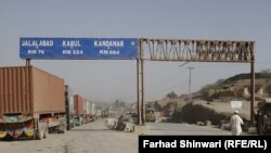 Trucks from Pakistan approach the Khyber Pass checkpoint on July 4 in anticipation of crossing the border into Afghanistan.