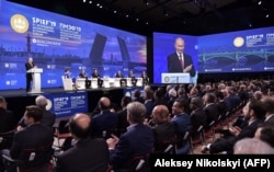 Russian President Vladimir Putin speaks at the St. Petersburg International Economic Forum on June 7. Organizers called it a celebration of Russia’s exit from the pandemic.