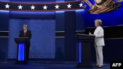 Republican presidential nominee Donald Trump (left) and Democratic presidential nominee Hillary Clinton arrive on stage for the third and final presidential debate at the University of Nevada in Las Vegas on October 19.