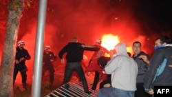 Riot police clash with pro-Serb opposition supporters in Podgorica.