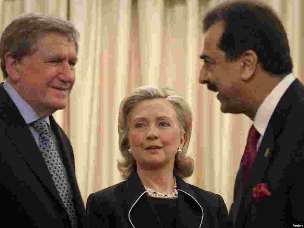 Holbrooke with U.S. Secretary of State Hillary Clinton and Pakistan's Prime Minister Yusuf Raza Gilani during a visit to Islamabad on July 18, 2010.