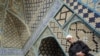 A Sunni Kurd prays at the Jame Mosque in the city of Sanandaj in Kurdistan Province. Sunnis complain of being marginalized by Iran's Shi'ite regime.