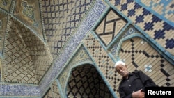 A Sunni Kurd prays at the Jame Mosque in the city of Sanandaj in Kurdistan Province. Sunnis complain of being marginalized by Iran's Shi'ite regime.