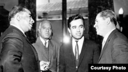 Kohzad (second left) stands with Asghar Khan (left), a high-ranking personality from Afghanistan, and two others from Uzbekistan.