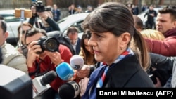 Laura Codruta Koevesi is surrounded by reporters as she arrives for a hearing at the Special Investigative Section for Prosecutors headquarters in Bucharest on March 7.