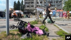 A baby stroller lies by a road after a deadly Russian missile attack in Vinnytsya on July 14. At least 23 people were killed, including three children.