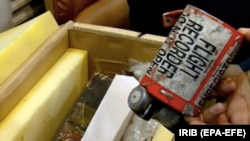 A video grab from Iranian TV showing what is described as the black box from the doomed Ukrainian airliner.