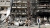 Afghan security forces inspect the site of the July 28 attack in Kabul.