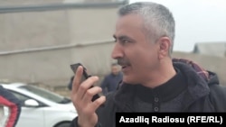 Fuad Qahramanli talks on the phone after being released from prison in March 2019.